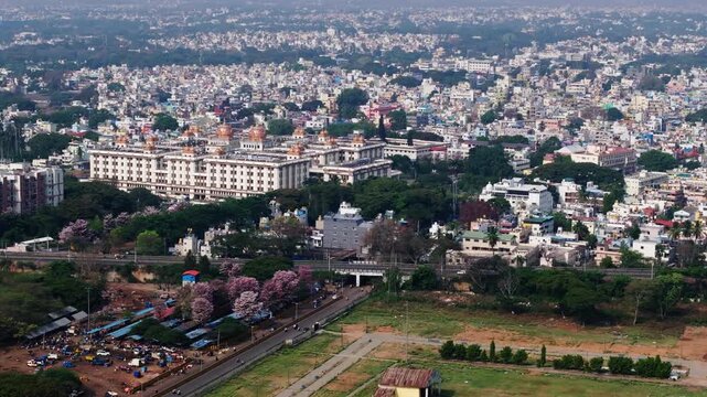 Aerial view of Mysore city with JSS Hospital, trees and flyover at karnataka, india. day time, semi orbit shot, drone shot, 4k.