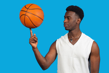 Male basketball player balancing spinning ball on finger © EDUARDOIVAN