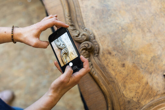 Photographing Wooden Furniture Detail with Smartphone
