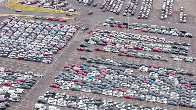 Aerial view of parked new cars at vehicle storage terminal