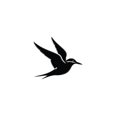 Obraz premium Black bird in flight silhouette.