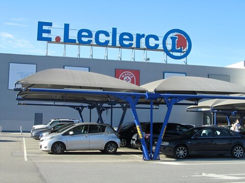 E.Leclerc supermarket building with parking lot and cars