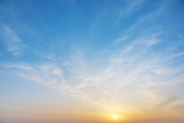 Fototapeta premium Blue Sky with Thin Clouds and Sunset Sun for Background