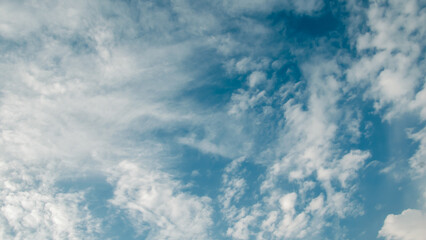 Obraz premium view from the airplane window to mountains clouds and blue sky