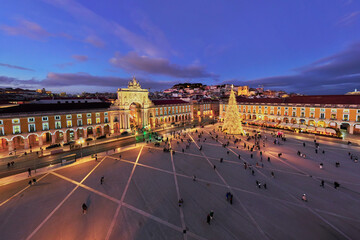 Praca do Comercio showcases a stunning Christmas tree and decorations, captivating visitors in the evening light of winter. © Dmitry Rukhlenko