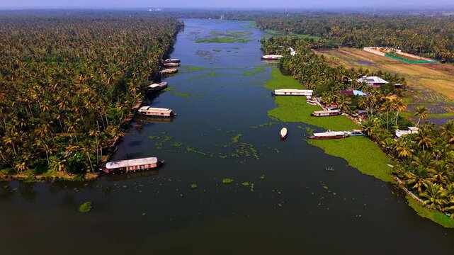 Panoramic drone shot around Kettuvallam houseboats in the waterways of Kochi