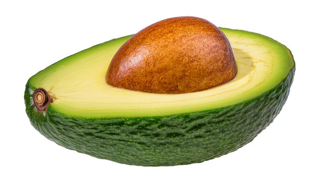 Ripe halved avocado with pit and green skin texture