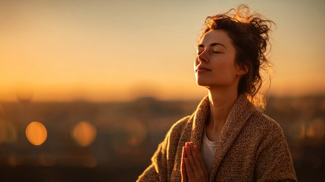 Woman meditating at sunset finding inner peace and mindfulness, copy space