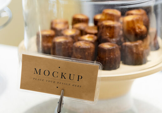 Delicious Pastries Under Glass Paper Sign Mockup PSD