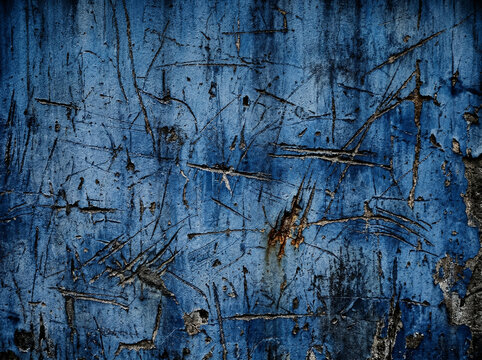 Textured Cobalt Canvas: An abstract, close-up view reveals a rugged, weathered surface of flaking, distressed cobalt paint with intricate patterns and textures.