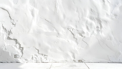 Obraz premium A textured white wall with a rough, uneven surface and a clean white floor creates a minimalist and abstract aesthetic.