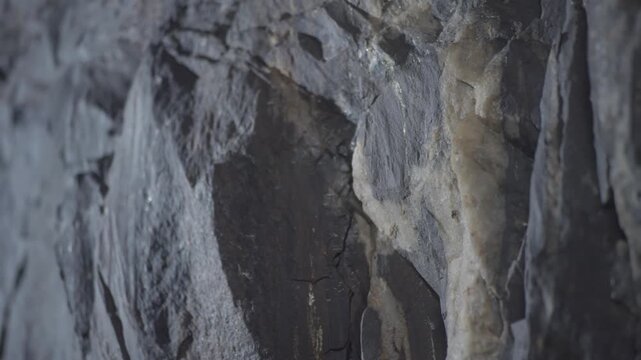 Rough gray stone surface forming a natural texture