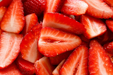 Fresh sliced strawberries, close up view. Strawberry background © pbd Studio