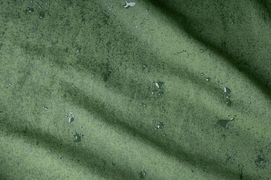 Waterproof fabric texture with rain drops closeup