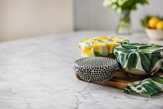 AI generated reusable food wraps on a clean kitchen counter with soft light and copy space eco friendly storage solution promoting sustainable zero waste lifestyle
