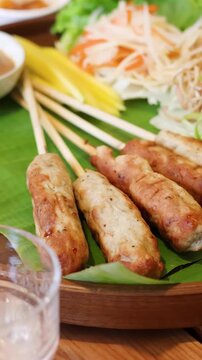 Vietnamese Grilled Pork Skewers Nem Nuong Served on Banana Leaf