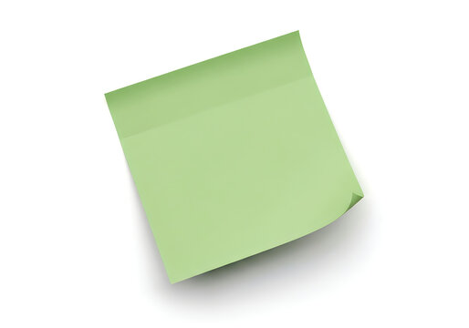 A crumpled green sticky note resting on a plain surface