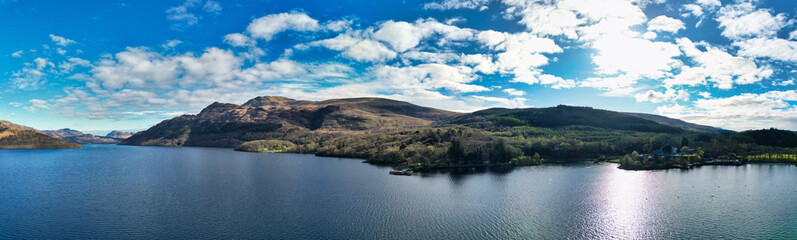 Fototapeta premium Panoramic Aerial View of Balmaha Valley Landscape Near Glasgow During Sunset Over Scotland, United Kingdom