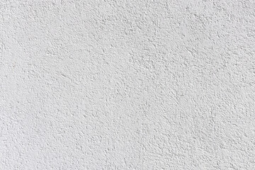 Fototapeta premium background of white structured plaster wall, painted in white