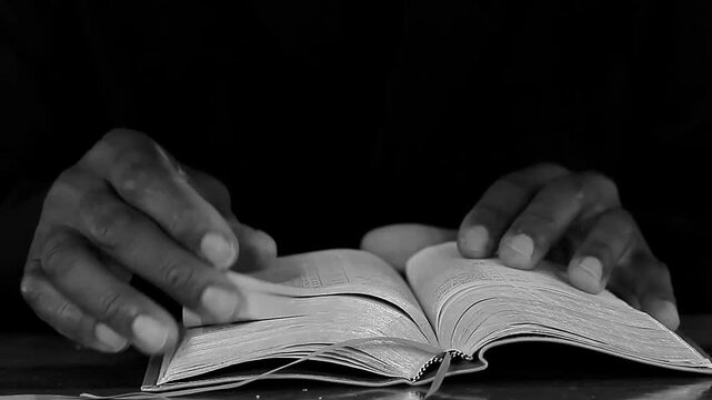 praying to God with hand's together on bible with people and white background stock video stock footage