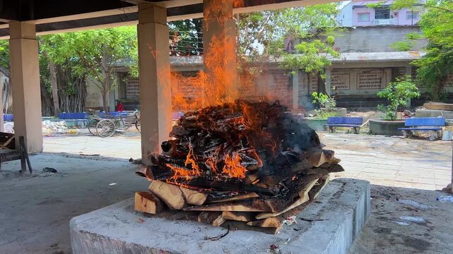 Hindu Cremation Ritual with Burning Pyre at Traditional Cemetery