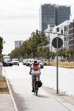 Long lane perspective in Frankfurt Germany shows bicycle commute transport through urban city street as cycleway infrastructure mobility supports sustainable everyday travel