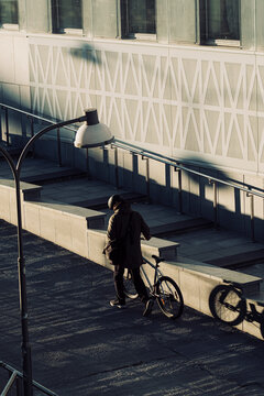 Graphic shadows in Stockholm Sweden show bicycle commute transport in urban city street space as cycleway infrastructure mobility supports sustainable metropolitan life
