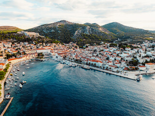 Fototapeta premium Aerial view of the historic Hvar town and the Spanish Fortress (Fortica) overlooking the harbor and Adriatic sea, Hvar island, Dalmatia, Croatia.