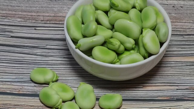 shelled broad beans in a bowl zoom out