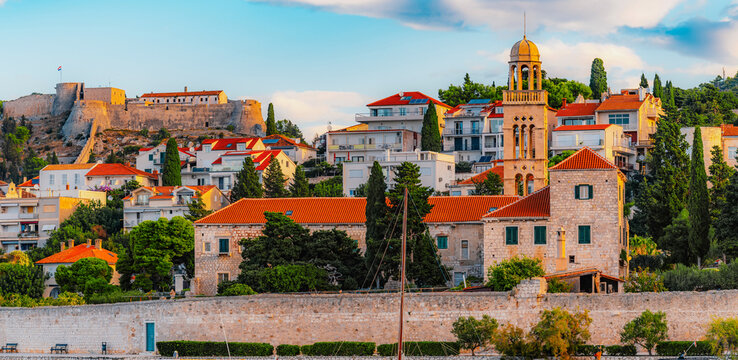 Hvar town and Pakleni Islands viewed from the medieval Spanish Fortress, golden hour over the Adriatic sea, Croatia.