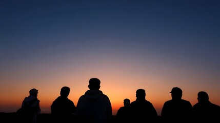 Fototapeta premium Group of friends sharing a peaceful moment watching the vibrant colors of dawn paint the horizon