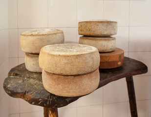 traditional handmade cheese head, made from cows milk of the high mountain pastures © pavlobaliukh