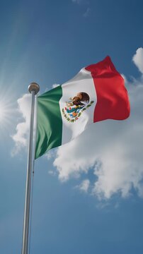 mexican flag waving in the wind. flag of mexico in blue sky