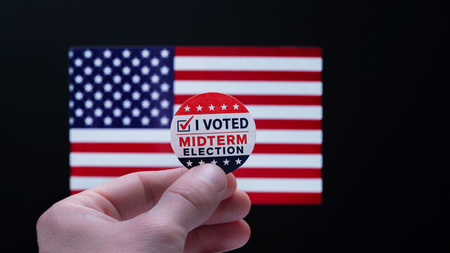 focus on Midterm election, Concept of 2026 American Midterm Elections. Midterm Election sign in front of US flag