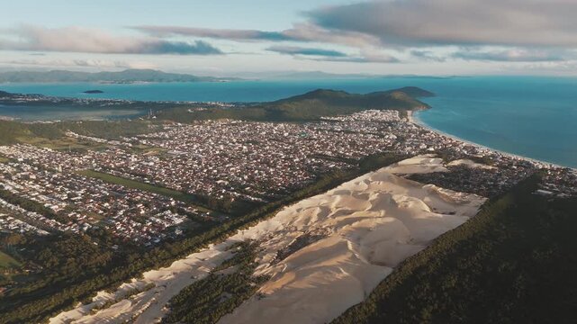 Aerial view of the town of Ingleses and its dunes during sunrise on the island of Santa Catarina. Florianopolis, Brazil