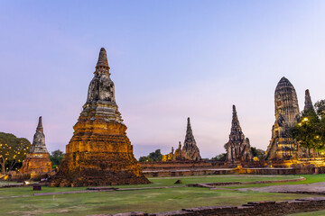 Fototapeta premium Ancient stone stupa ruin architecture in historical park at peaceful twilight. Beautiful majestic temple complex inspiring awe and tranquility across province sky landscape