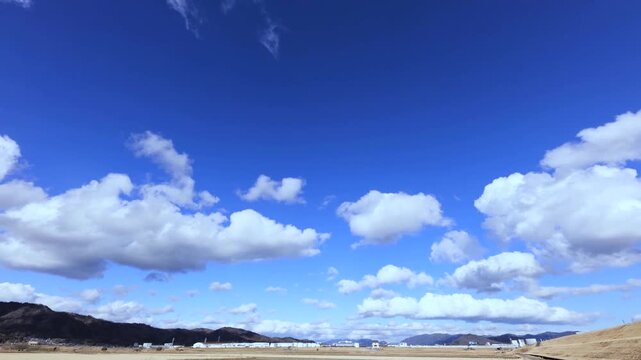 HD Timelapse of Thick Clouds in Cool Tones Moving from Left to Right (No Audio)