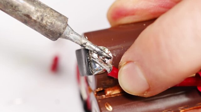 The process of repairing battery connections is shown