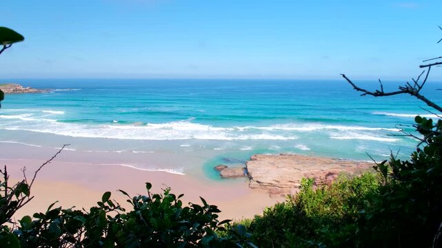 Scenic clear ocean waves running onto deserted beach, Robberg Nature Reserve