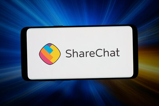 Stuttgart, Germany - 04-13-2026: In this photo illustration, the logo of Indian social networking company ShareChat is displayed on a smartphone in front of abstract background on computer screen.