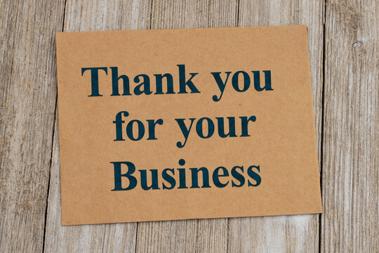 Thank you for your business card on rustic wood desk