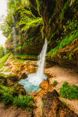 Obraz premium The Pericnik slap or Pericnik Fall is located in Triglav National Park, Slovenia. It is a big waterfall that falls from the cascade