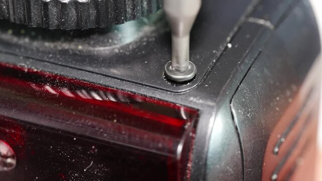Repairing electronic parts with precision tools in workshop