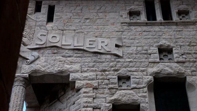 Mallorca, Spain. 07-28-2026. Soller Bank facade on stone wall. Video 4K