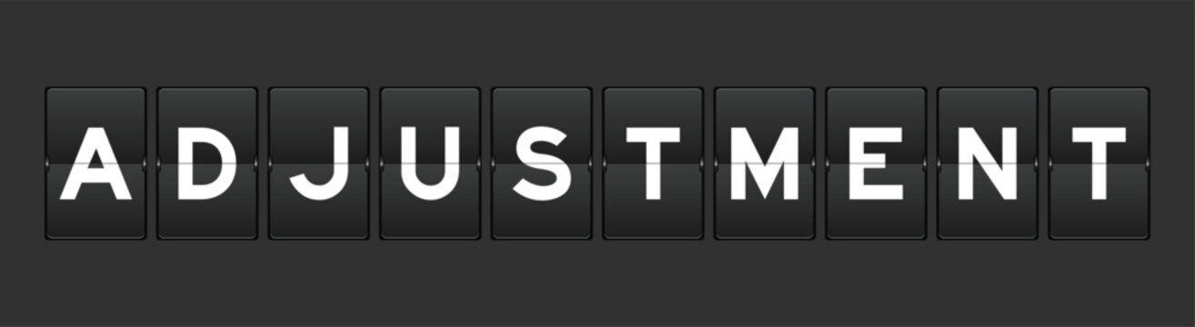 Black color analog flip board with word adjustment on gray background