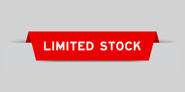 Red color inserted label with word limited stock on gray background