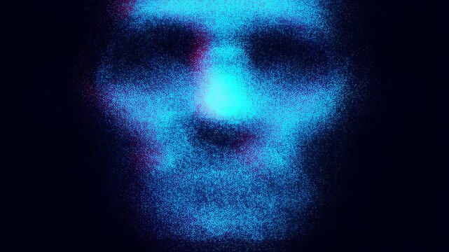 Slow motion reveal of human face forming from millions of blue cyan particles on dark studio background with grainy particle dissolve close up