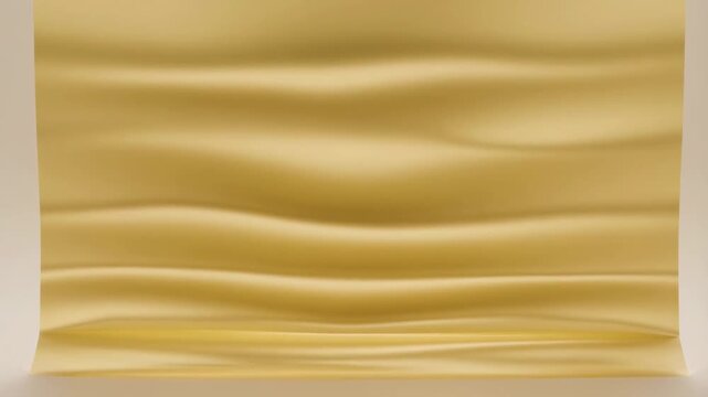 Static shot of gold fabric unrolling and rippling against neutral studio backdrop with subtle slow motion frontal view