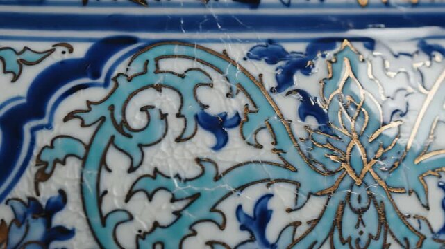 Intricate Blue and Teal Floral Pattern on Antique Ceramic Tile.
