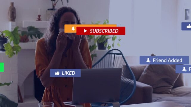 Woman typing at laptop, initiating subscribe or liked badges across screen for creators, reacting